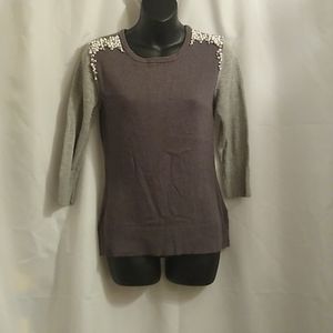 A. Byer grey shirt with faux pearls on the shoulder and quarter sleeves
